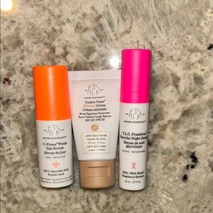 Drunk Elephant Skincare Set with Orange, White, and Pink Packaging